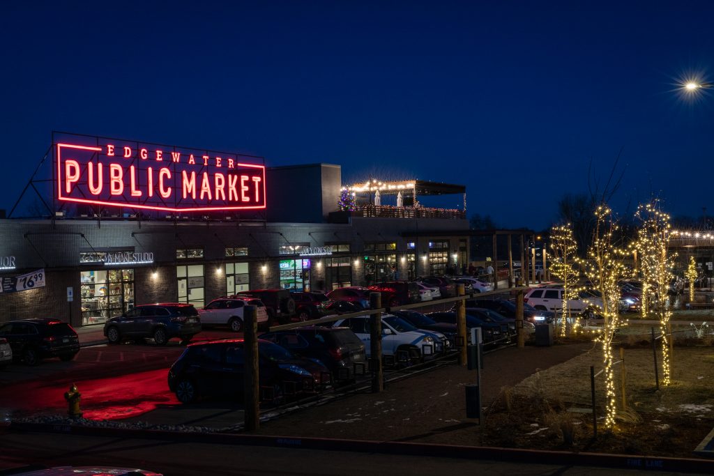 nighttime exterior photo of illuminated sign for Edgewater Public Market