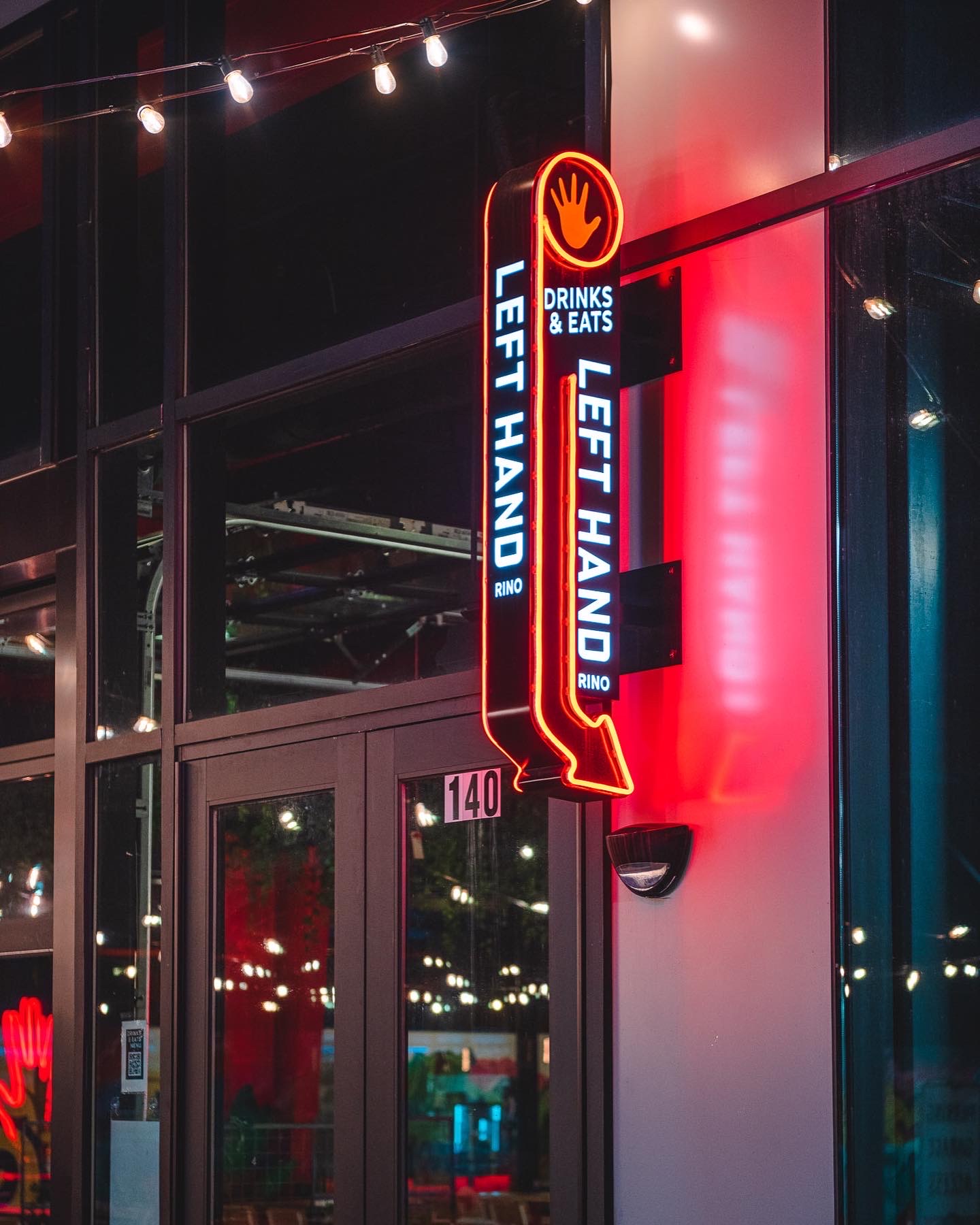Left Hand projecting illuminated Sign near mission ballroom