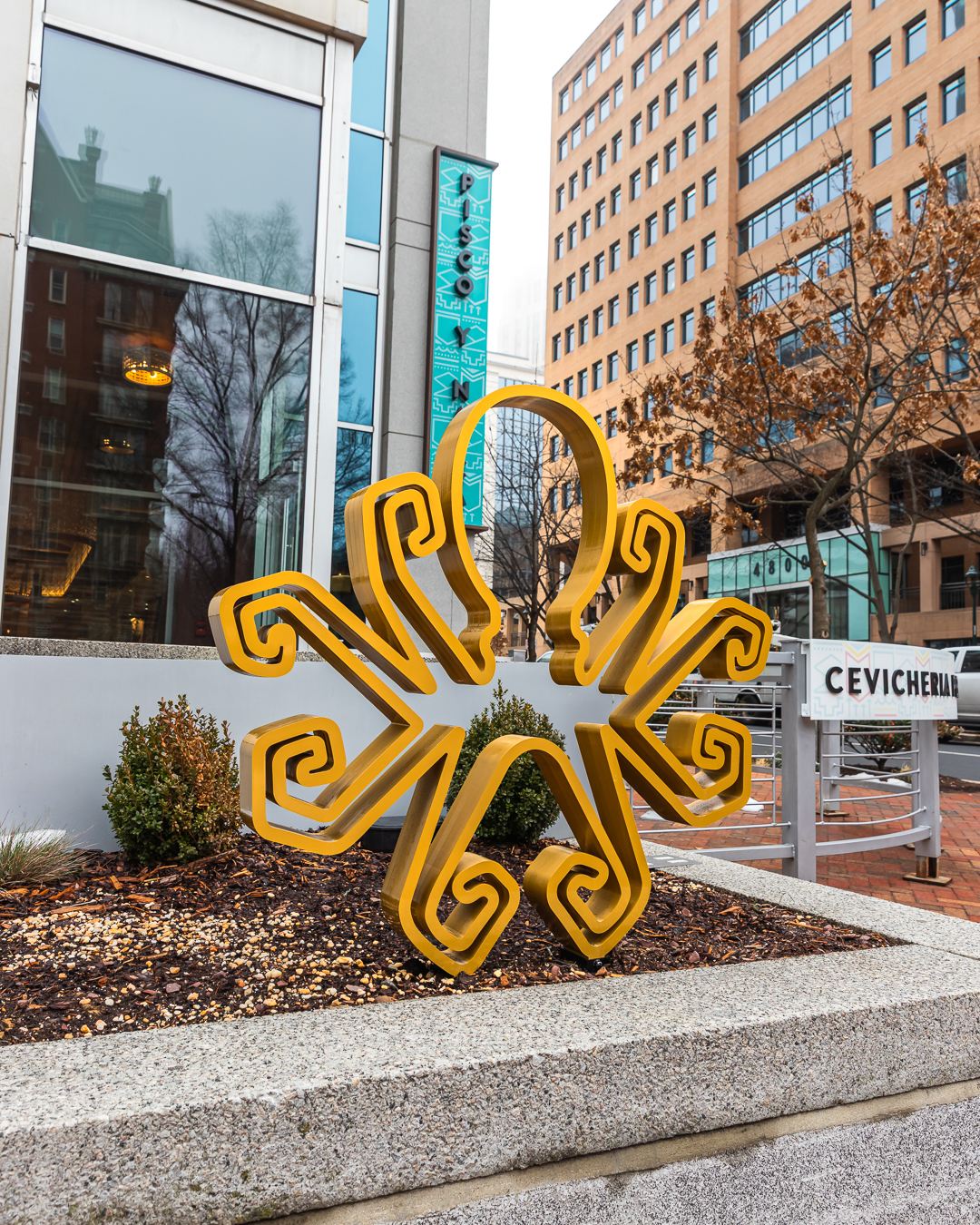 Custom fabricated sculptural octopus signage feature installed in restaurant garden for Pisco Y Nazca in Bethesda Maryland