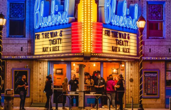 Restored Bluebird Theater marquee with new neon and lighting on East Colfax in Denver