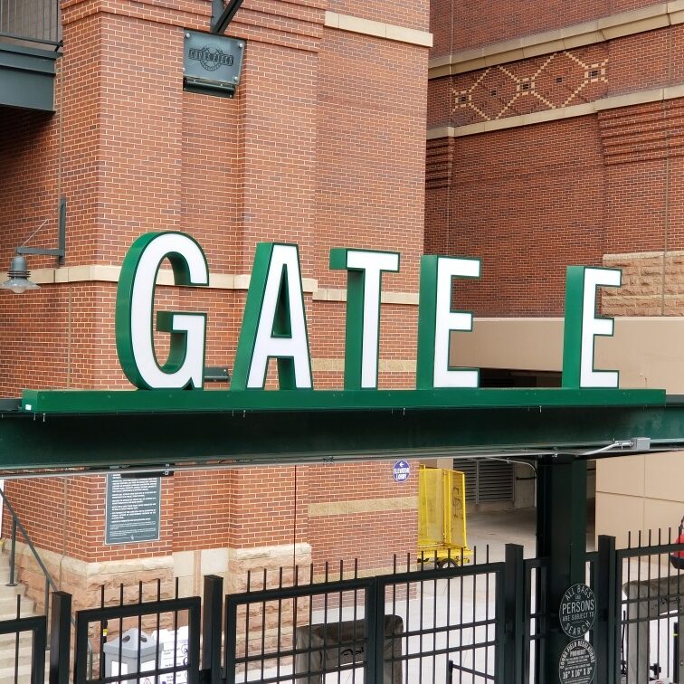 Exterior channel letters mounted on steel frame at Gate E entrance of Coors Field in Denver