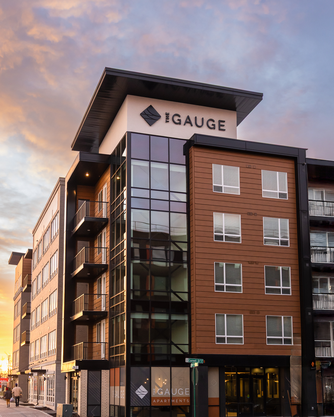large illuminated building letters installed on the gauge apartments multifamily development in salt lake city