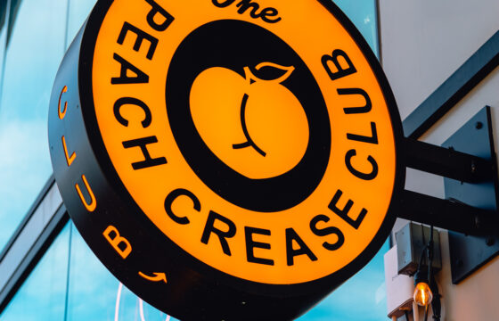custom bar signage installation for Peach Crease Club near Mission Ballroom daytime street view