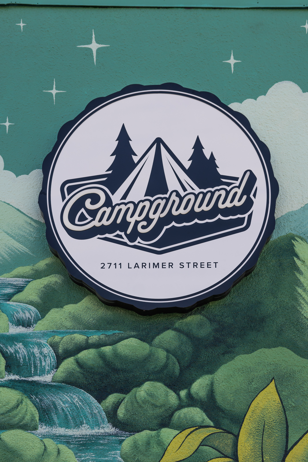 Close-up of the Campground custom sign face showing painted graphics and dimensional lettering.
