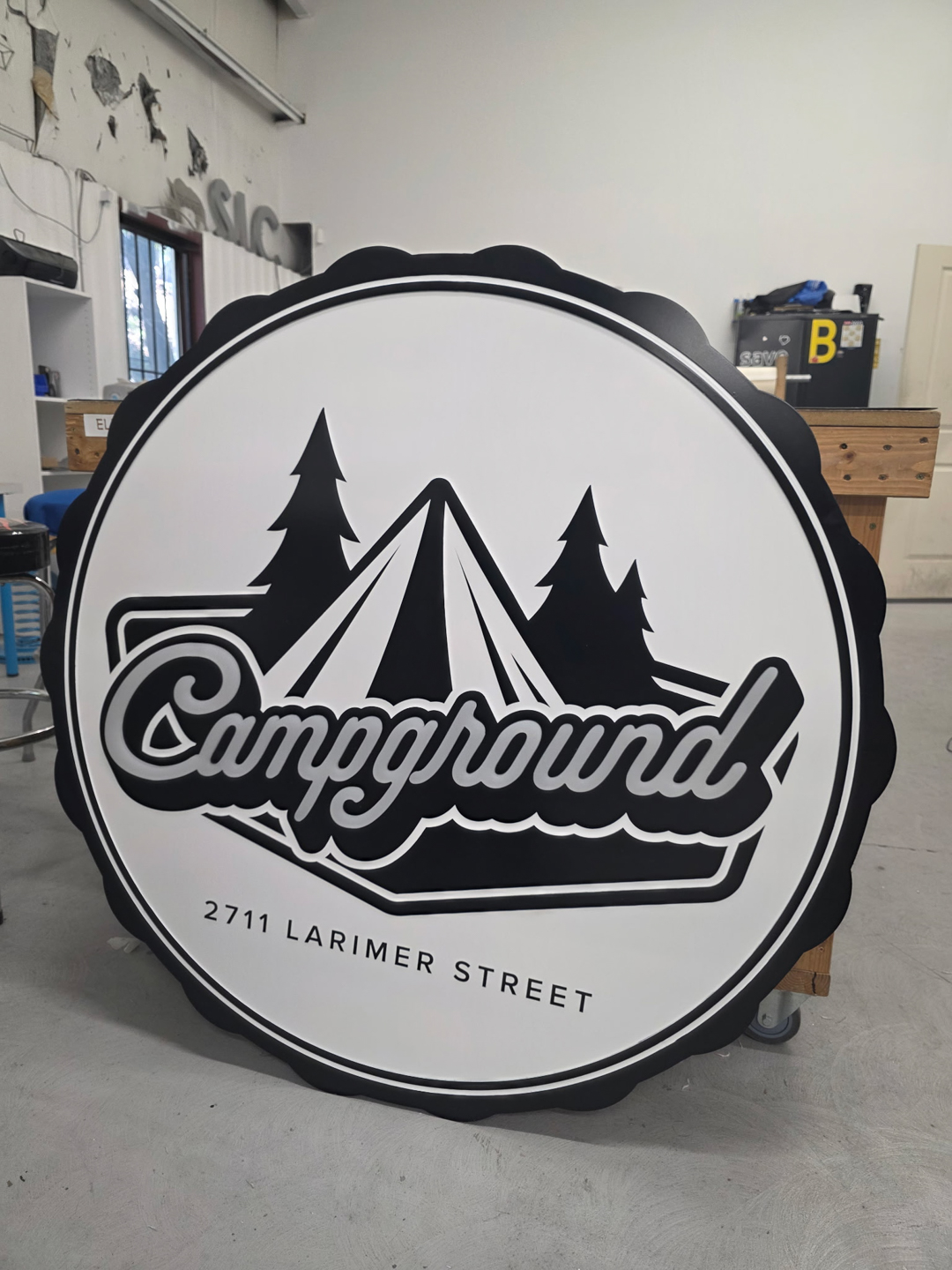 Custom Campground sign face fabricated by RiNo Sign Works featuring push-through acrylic letters and a scalloped-edge cabinet.